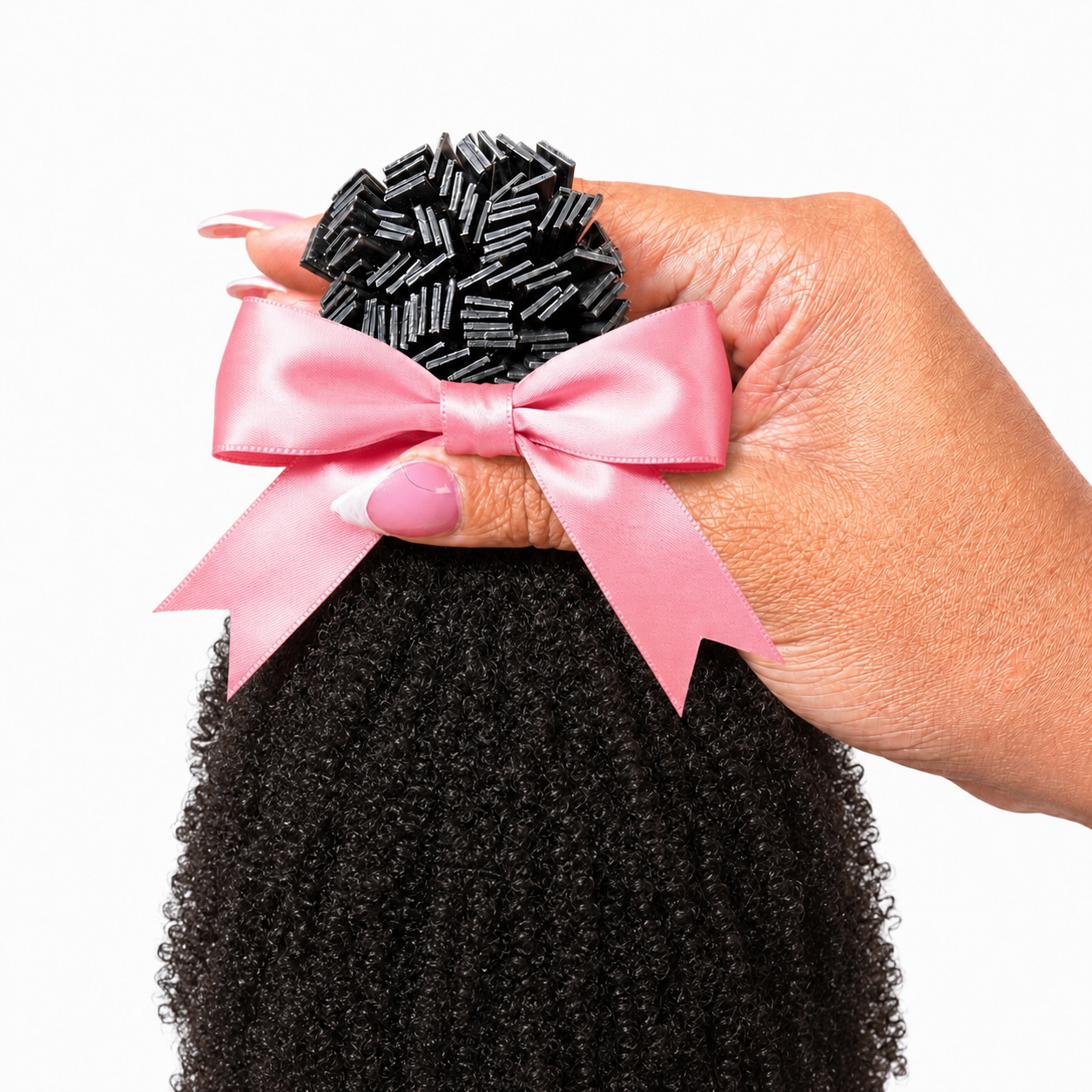 1B 4C K-Tip extensions 100g pack held in hand with pink satin bow — Natural Coily Collection by TT Does It All