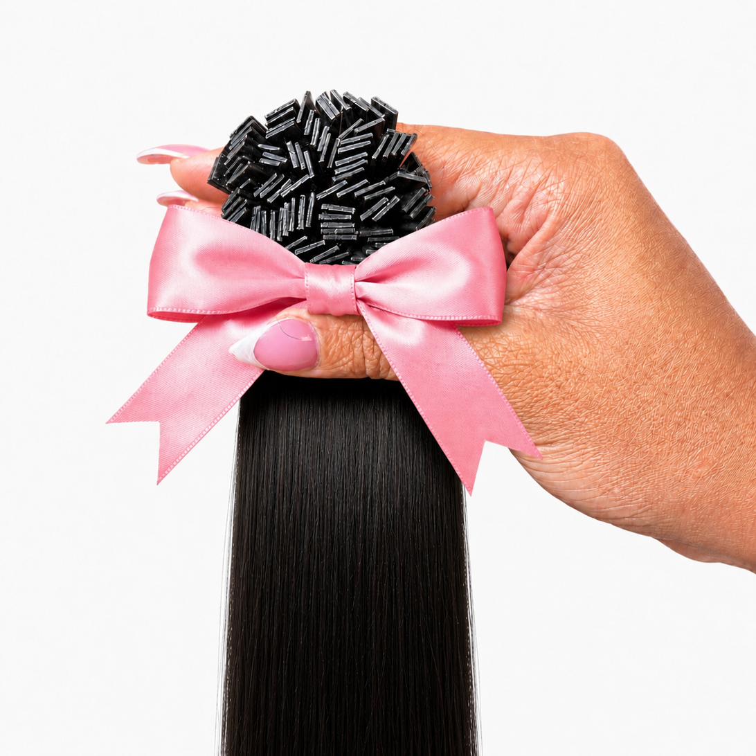 1B Kinky Straight K-Tip extensions 100g pack held in hand with pink satin bow — Straight Collection by TT Does It All