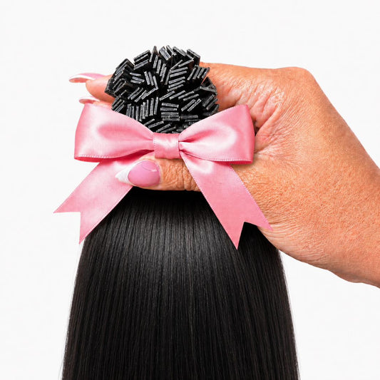 1B Straight K-Tip extensions 100g pack held in hand with pink satin bow — Straight Collection by TT Does It All
